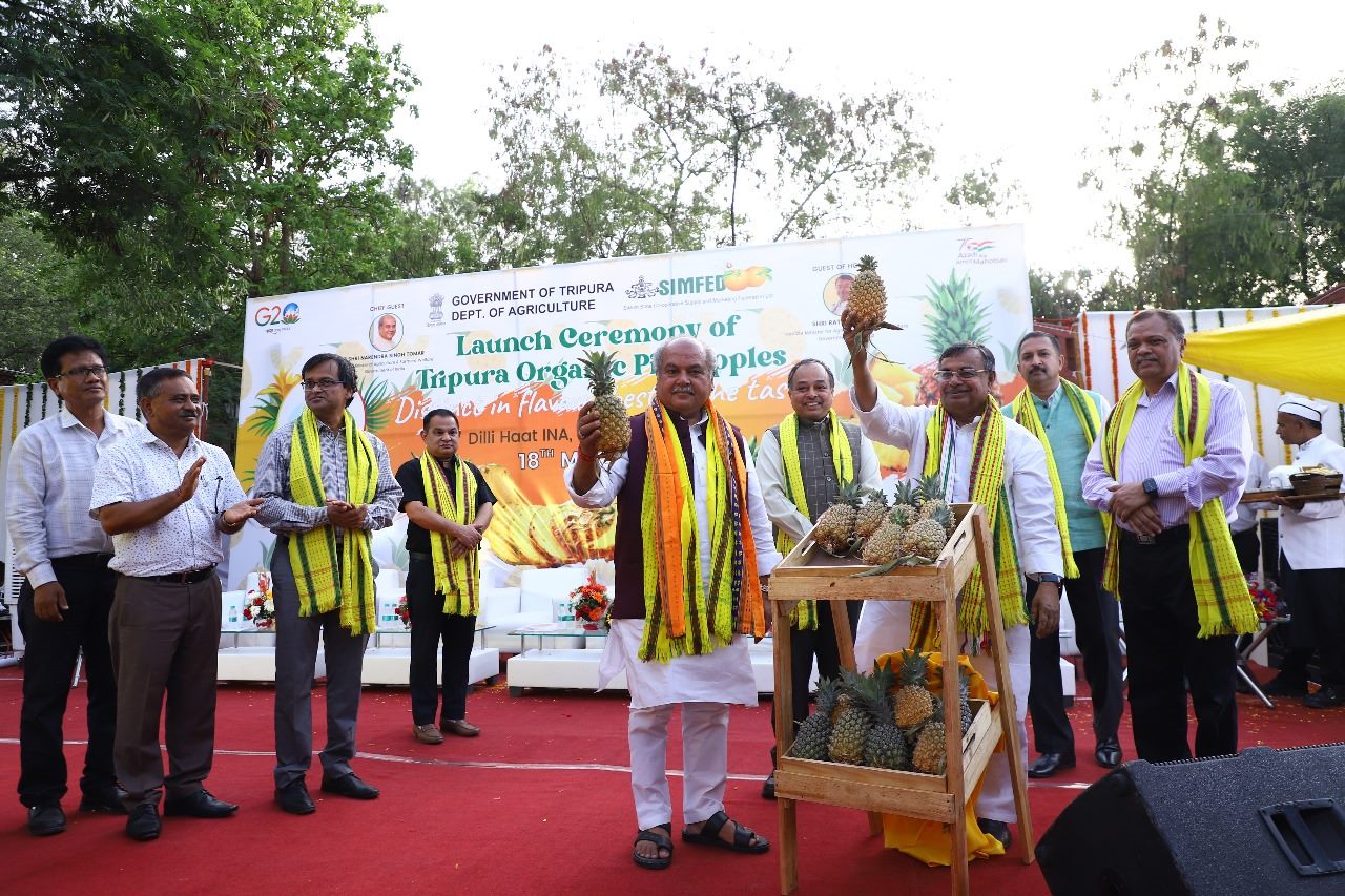 Officials on stage at the launch of GI-tagged Tripura Queen Pineapples.